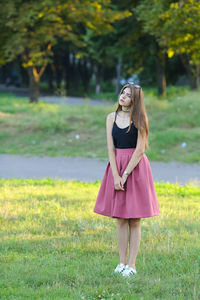 Full length of woman standing on field