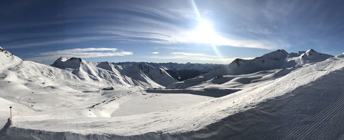 Scenic view of snowcapped mountains against sky