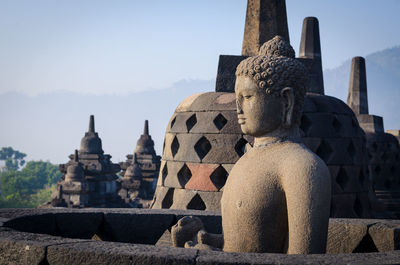 Ancient temple against building