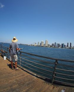 Man standing in front of river