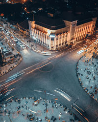 High angle view of people on city street at night