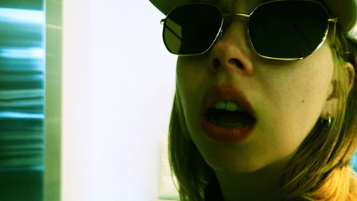 Close-up of young woman wearing sunglasses