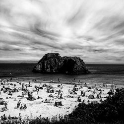 Scenic view of sea against cloudy sky