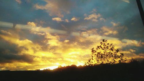 Scenic view of landscape at sunset