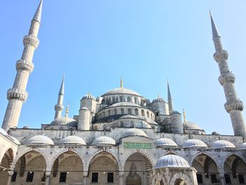Low angle view of sultan ahmed mosque against clear blue sky