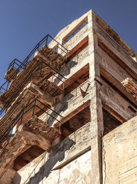 Low angle view of old building against clear sky