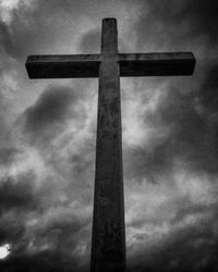 Low angle view of cross against sky