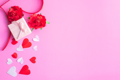 Close-up of pink rose over white background