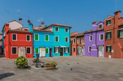 Residential buildings against blue sky