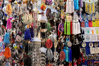 Full frame shot of multi colored umbrellas hanging at market stall