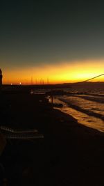 Scenic view of sea against clear sky during sunset