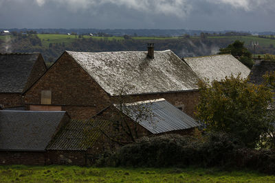 House on field against sky