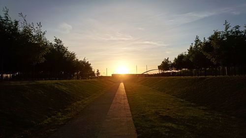 Scenic view of landscape against sky during sunset