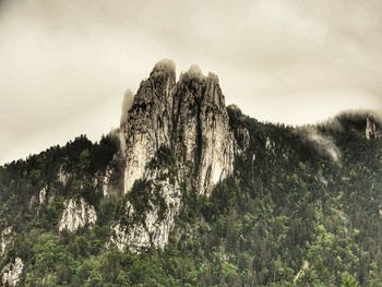 Rock formation on land against sky