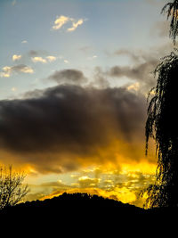 Low angle view of dramatic sky during sunset