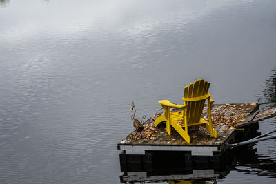 High angle view of yellow moored by lake