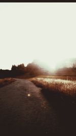 Empty road at sunset