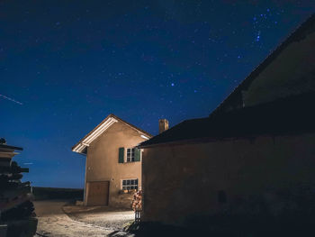 Low angle view of house against sky at night