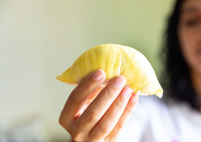 Close-up of woman holding fruit