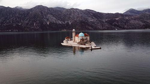 Boat in lake against sky