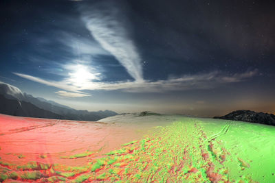 Scenic view of field against sky at night