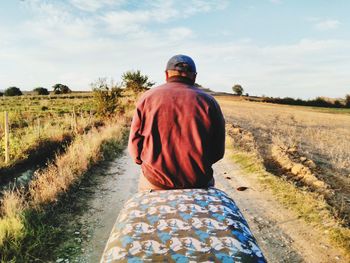 Rear view of man on field