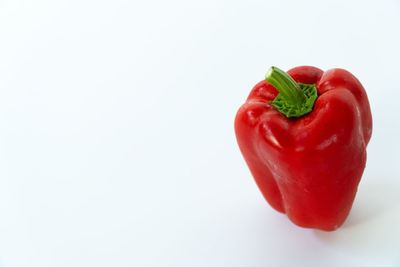 Close-up of red bell pepper against white background