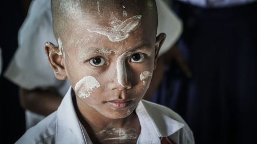 Close-up portrait of boy with painted face