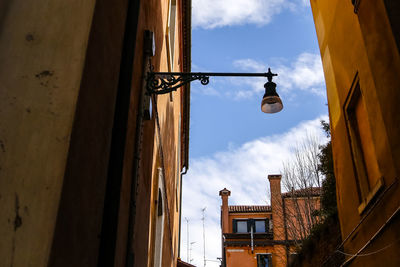 Low angle view of street light against sky