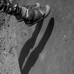 High angle view of person standing on footpath