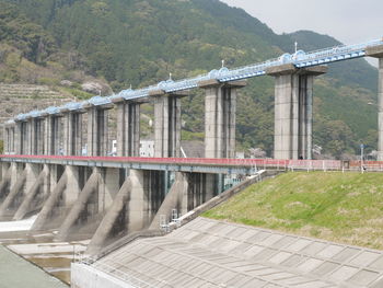 View of dam against bridge