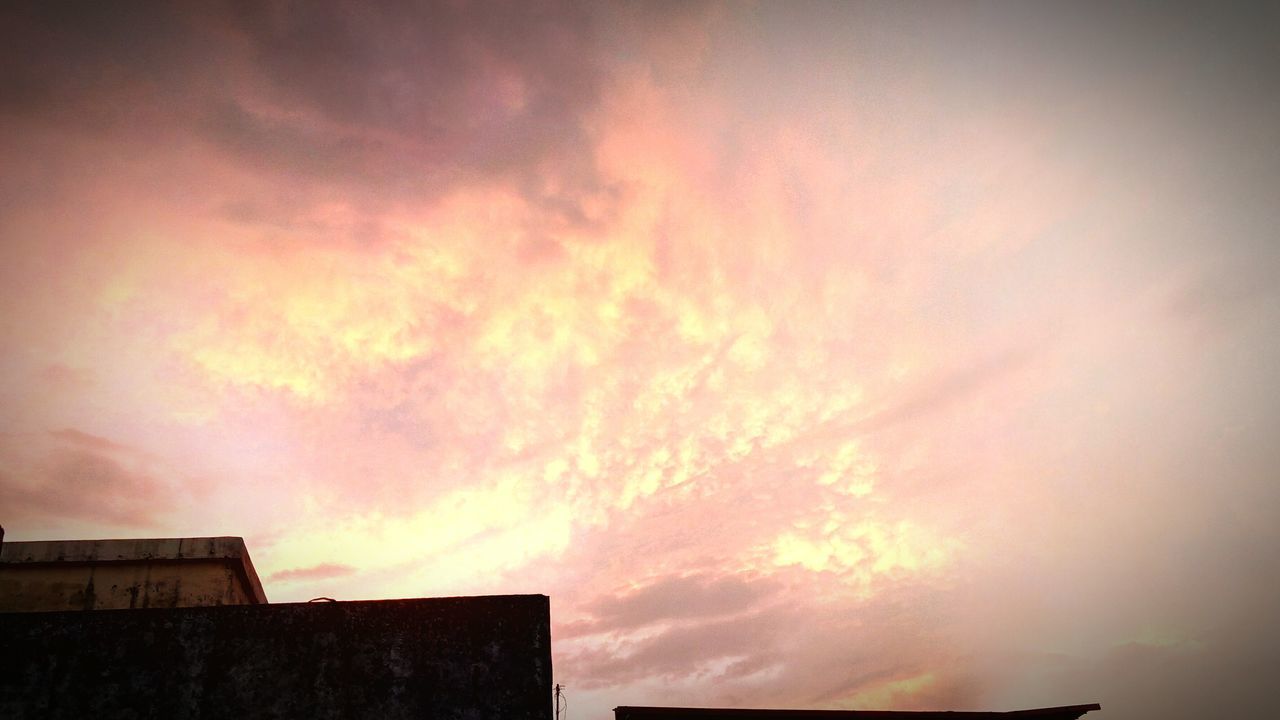 LOW ANGLE VIEW OF SILHOUETTE BUILDINGS AGAINST SKY AT SUNSET