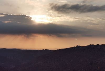 Scenic view of silhouette mountain against sky during sunset