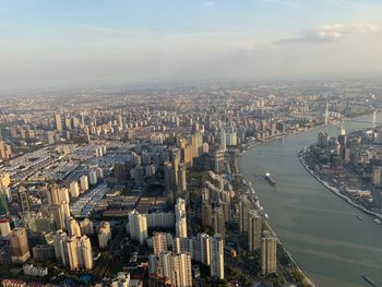 High angle view of city buildings by river