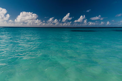 Scenic view of sea against blue sky