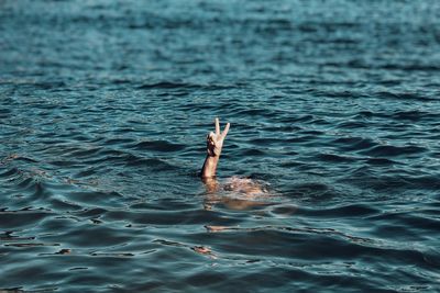 Woman swimming in sea