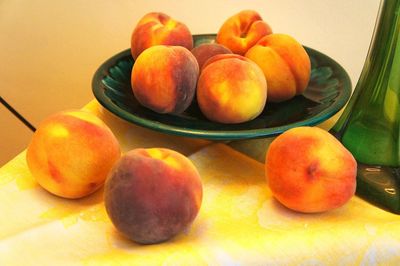 Close-up of oranges on table