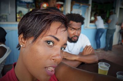 Close-up of young woman sitting in restaurant