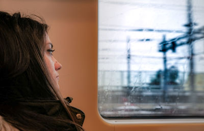 Young woman traveling in train