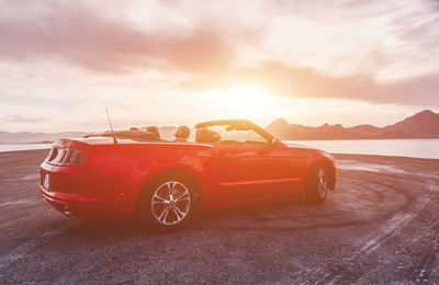 Vintage car against sky during sunset