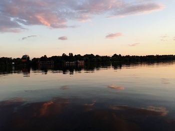 Scenic view of lake against sky at sunset