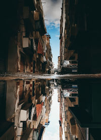 Panoramic view of buildings in city against sky