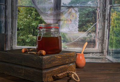 Close-up of glass jar on table