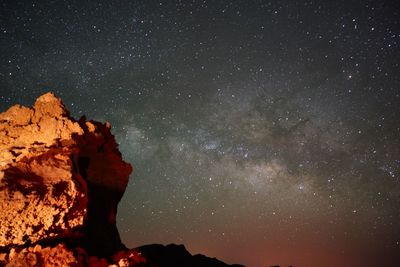 Low angle view of rock formation against sky