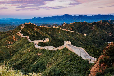 High angle view of mountain range against cloudy sky