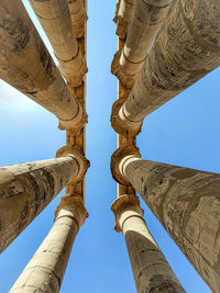 Low angle view of luxor temple columns and clear sky