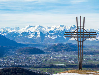 Scenic view of snow covered mountains against sky
