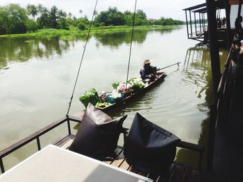 People sitting on boat sailing in river