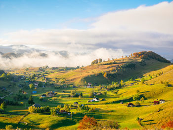 Scenic view of mountains against cloudy sky