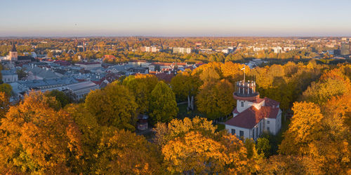 High angle view of trees and buildings against sky